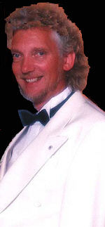 Robert Freeman in typical costume for corporate magic, close-up magic and cruises.